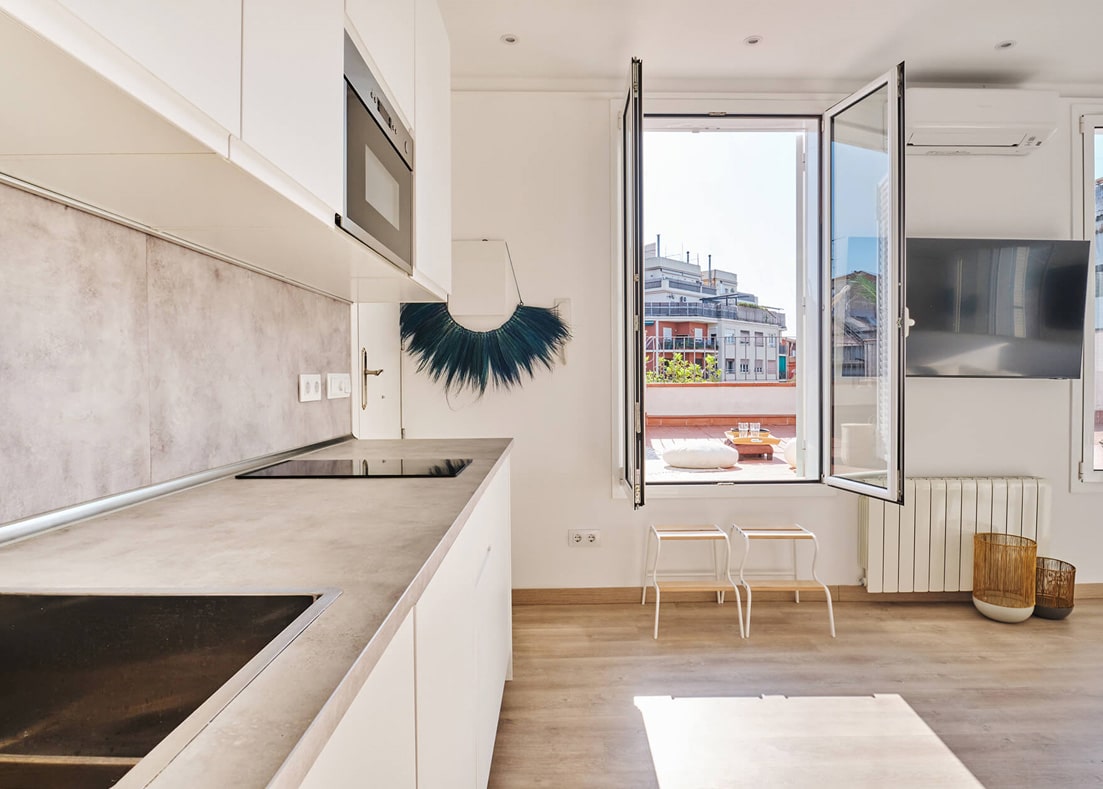 Barcelona roof studio - second-floor studio, kitchen area with glass doors that open to the roof, designed by Beatrice Leupold Barcelona roof studio - second-floor studio, kitchen area with glass doors that open to the roof, designed by Beatrice Leupold